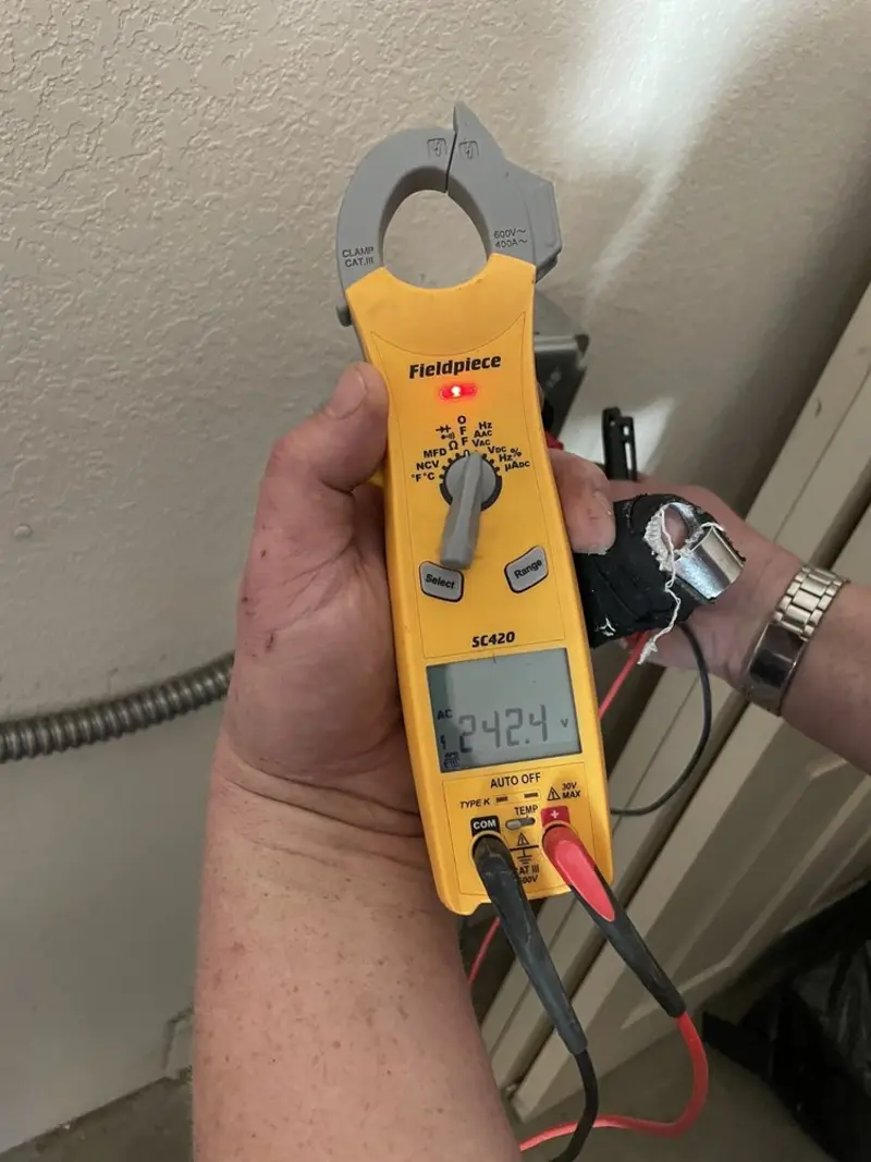 Voltage testing with clamp meter during Outlet Installation in Mogadore